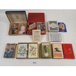A tray of seven antique and vintage playing cards, some un-opened, a vintage 'Valuation' card game