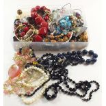 A collection of costume jewellery to include necklaces, earrings etc.