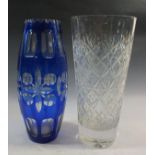 A blue flahsed cut glass vase and a cut glass vase