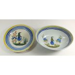 A late 19th century Quimper plate painted male figure by Henriot and a similar bowl