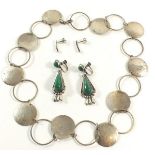 A pair of Mexican silver earrings, another pair of silver earrings and a hammered necklace