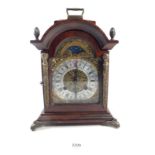 A German striking walnut mantel clock by Franz Hermle with key, 30cm tall