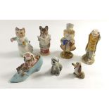 A Beswick figure 'The Amiable Guinea Pig' and 'Sir Issac Newton' plus three other Beatrix Potter