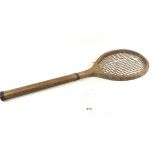 An early 20th century childs wooden tennis racket, probably French, 60cm long