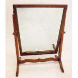 An Edwardian mahogany swing toiletry mirror