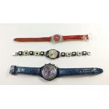 Three Swatch watches