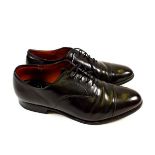 A pair of handmade Church's custom grade mens shoes (size 10) with leather uppers and leather