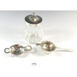 A silver topped glass preserve pot and two silver tea strainers, - tea strainers 44g