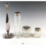 A silver specimen vase and three glass and silver toiletry bottles etc.