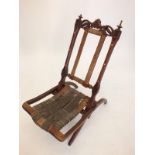 A Victorian folding small carved campaign chair