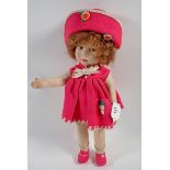 A Lenci doll with pink felt hat, dress and shoes, 41cm, one button on shoe missing