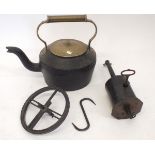 A cast iron kettle and bottle jack with key