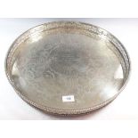 A large circular silver plated tray