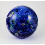 A large Murano end of day paperweight in cobalt blue with inset silver aventurine and scattered