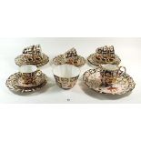 A Royal Crown Derby Imari tea service No 2251 comprising: six cups and saucers, six tea plates, cake
