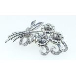 An 18 carat white gold floral spray brooch set diamonds, 14.5g, 4.2 x 3.2cm, boxed