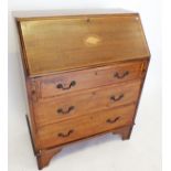 An Edwardian mahogany bureau with inlaid shell to slope front