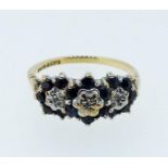 A 9 carat gold sapphire and diamond chip triple cluster ring, size N 1/2