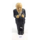 A plaster figure of Winston Churchill, 22cm tall