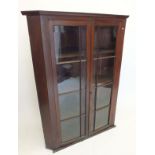 An Edwardian large mahogany corner display cabinet, 138 cm high.