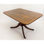 A George III tilt top rectangular mahogany breakfast table on turned column and splay supports