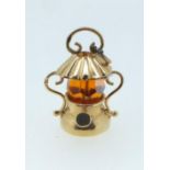 A gold charm in the form of a lantern, unmarked but tested as 14ct, 4g
