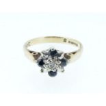 A 9 carat gold small sapphire and diamond cluster ring, size J to K