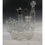 A claret decanter and various other decanters and a cut glass biscuit barrel