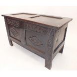 A small oak and elm 18th century coffer with two panel carved front, 101cm x 47cm x 58cm