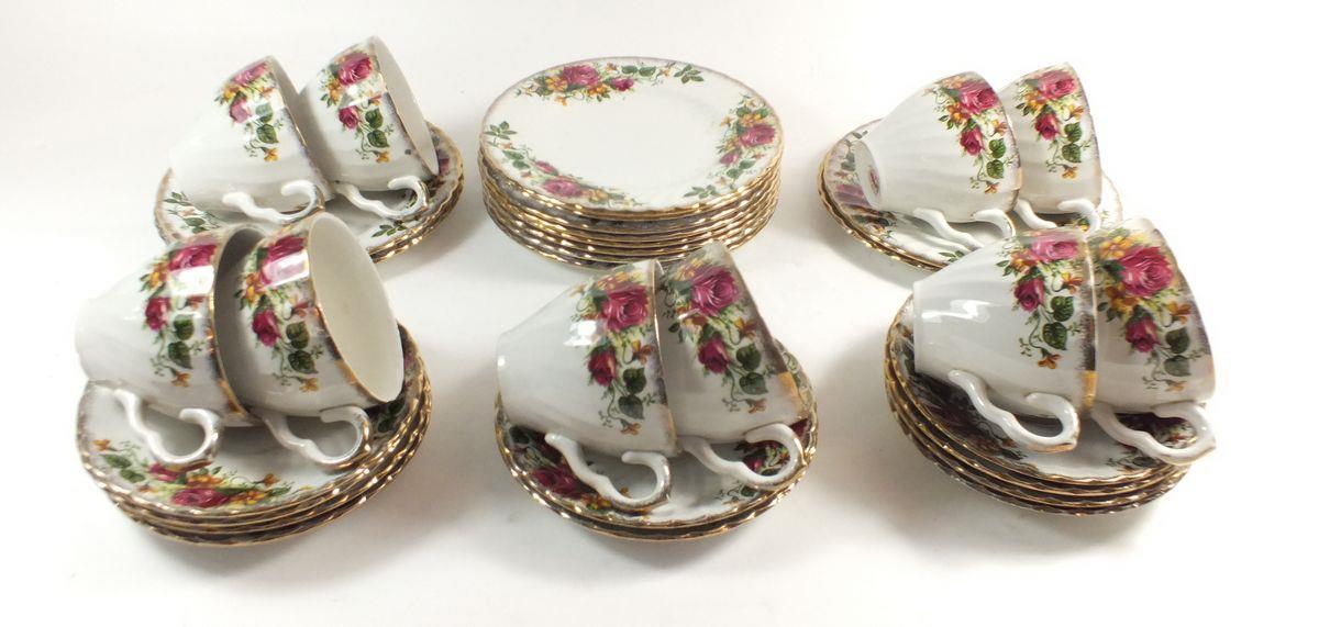 A Washington 'English Rose' tea service comprising: ten cups and saucers, and ten tea plates
