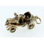 A 9 carat gold charm in the form of a car, unmarked but tested, 4.3g