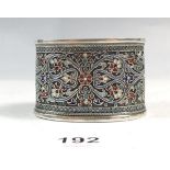 A silver napkin ring with cloisonné enamel Persian style decoration, 44g, GK makers mark