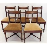 A set of five early 19th century mahogany dining chairs on turned supports united by a cross