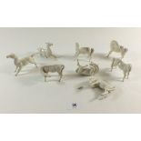 A set of eight Chinese white porcelain horses, and one a/f