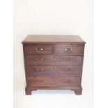 A Georgian mahogany bachelors chest of two short and three long drawers with brushing slide, 86 cm