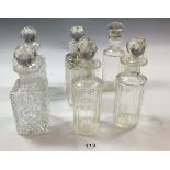 A group of seven glass toiletry bottles