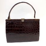 A vintage crocodile skin handbag