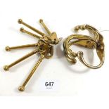 Two sets of six antique brass coat hooks