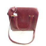 A Cartier large burgundy leather handbag