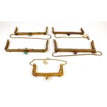 Five gilt metal vintage evening bag frames, the four larger set with 'stones'