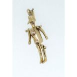 A 9 carat gold charm in the form of Pinocchio, unmarked but tested, 3.9g