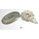 A continental silver sugar strainer with all over embossed decoration with cherubs, 55g, unmarked