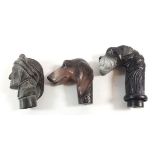 Two contemporary walking stick handles in the form of a dogs head and a vintage bronze one cast as a