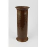 An early 20th century Arts and Crafts bronze spill vase with hammered finish, stamped to base GWG,