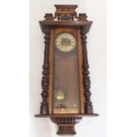 A 19th century large mahogany cased Vienna style wall clock