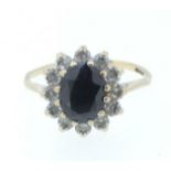 A 9 carat gold sapphire and white stone cluster ring, size O to P