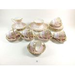 A Royal Stafford 1950's tea service comprising: eleven cups and twelve saucers, twelve tea plates,