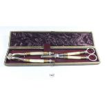 A pair of Victorian silver plated and onyx grape scissors and nut crackers