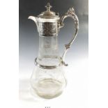 A Victorian silver plated and glass claret decanter engraved leaves