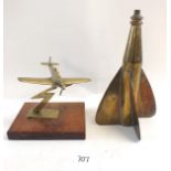 A brass model spitfire on mahogany base and a brass ships speed log
